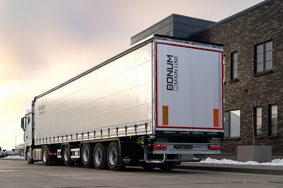 Curtain semi-trailer 13,62 m with outrigger axle for transporting steel rolls