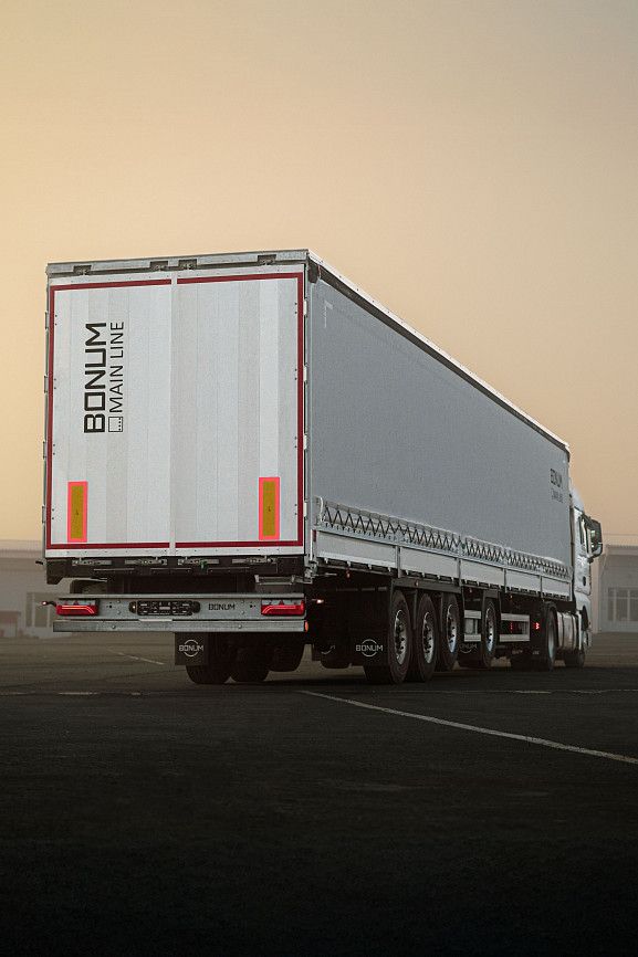 Curtain-side semi-trailer 16,52 m with outrigger axle