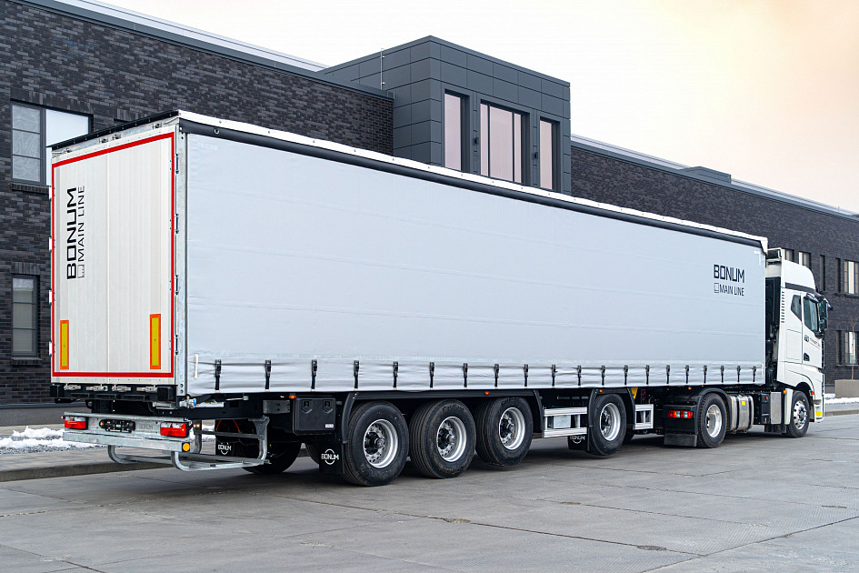 Curtain semi-trailer 13,62 m with outrigger axle for transporting steel rolls